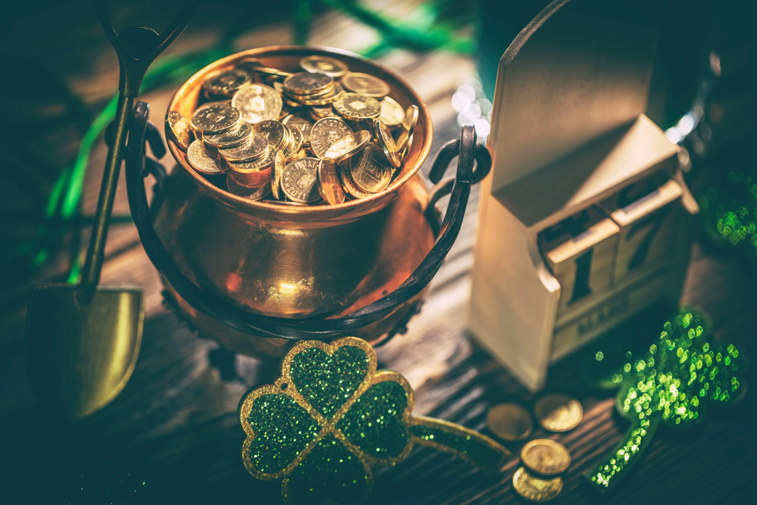 A pot of gold coins and green shamrock