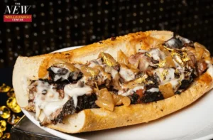 A Philly cheesesteak topped with edible gold leaf