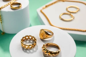 Assorted recycled gold rings displayed on podiums