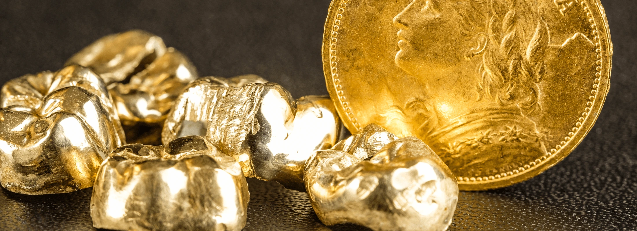 gold dental crowns and a gold coin bullion